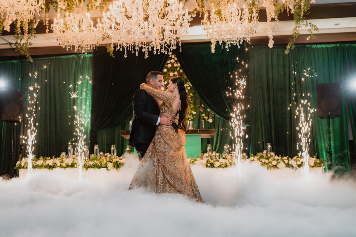 emerald-green-gold-luxury-reception-dance-fog-sparklers-bride-lehenga