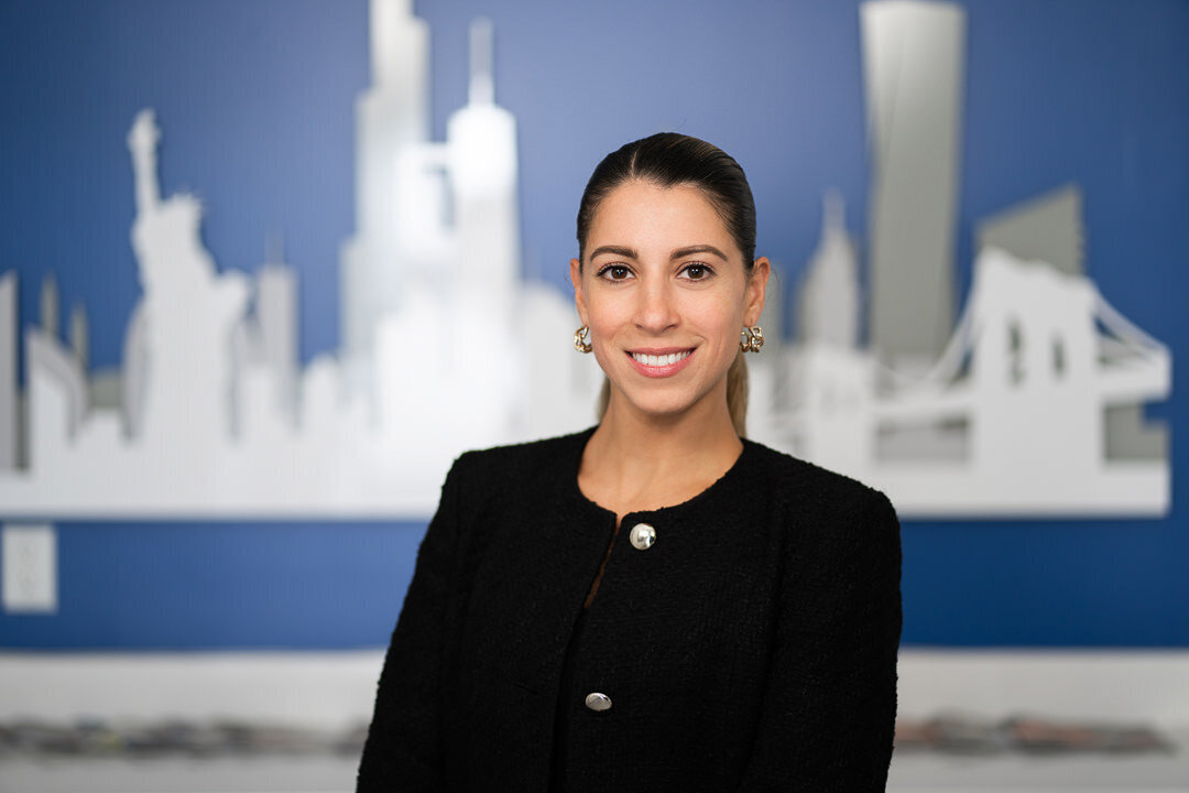 Bergen County professional headshot of smiling woman with city backdrop background