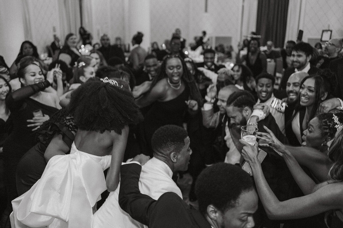 black wedding guests having fun dancing at wedding reception
