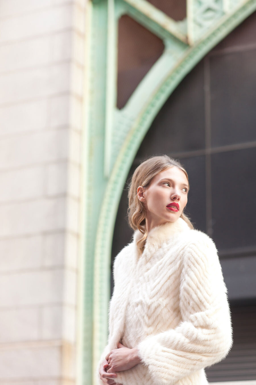 Mod hair and makeup 60s fashion red lip and fur coat beautiful classic woman with blonde hair