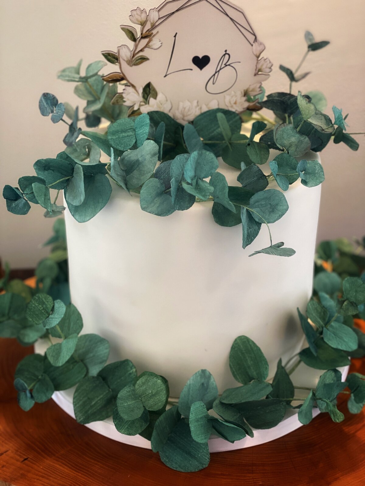 Single tier wedding cake with wafer paper eucalyptus