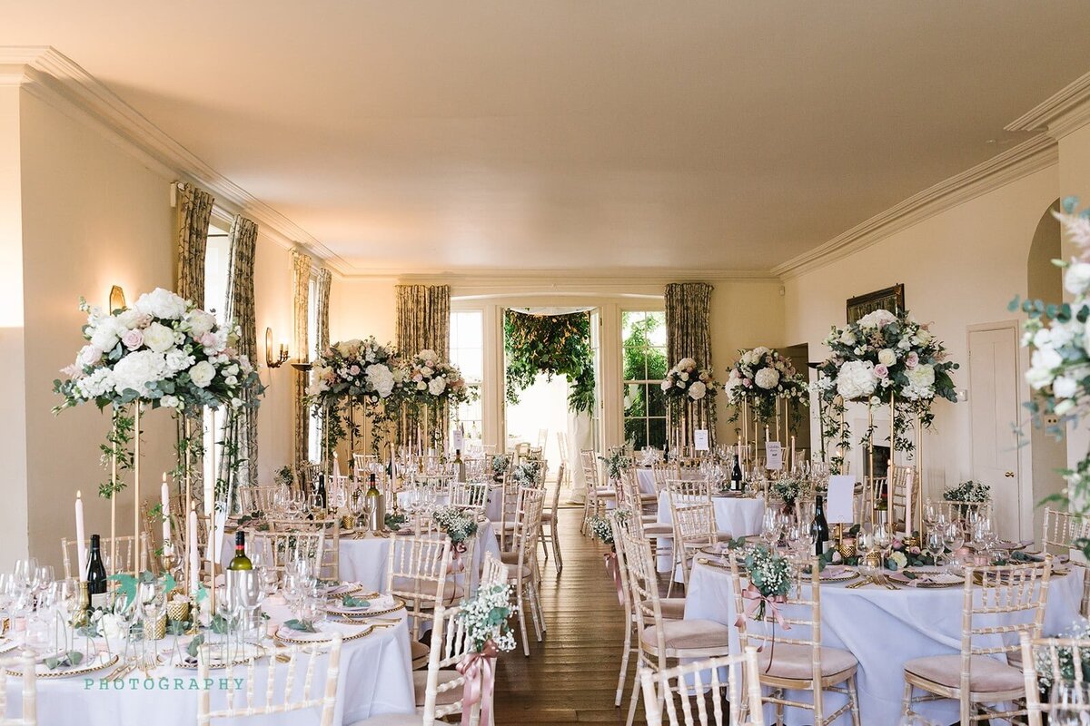 The wedding breakfast set up with beautiful flowers at Boconnoc Estate