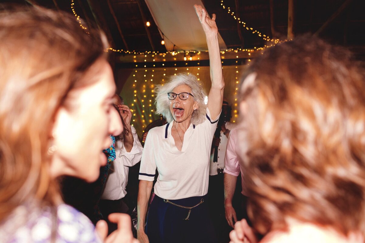 Mother of the groom dancing at wedding reception