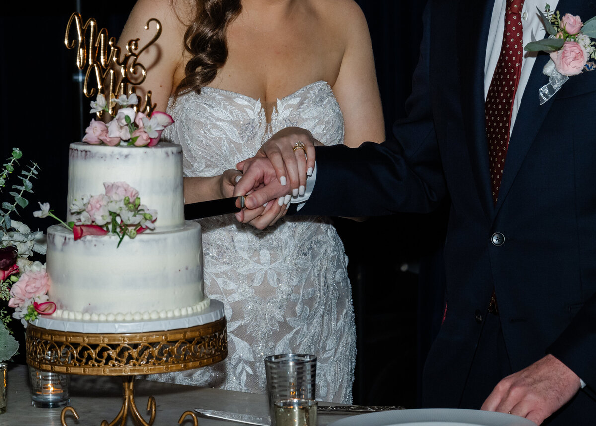 wedding cake cutting ballroom reception