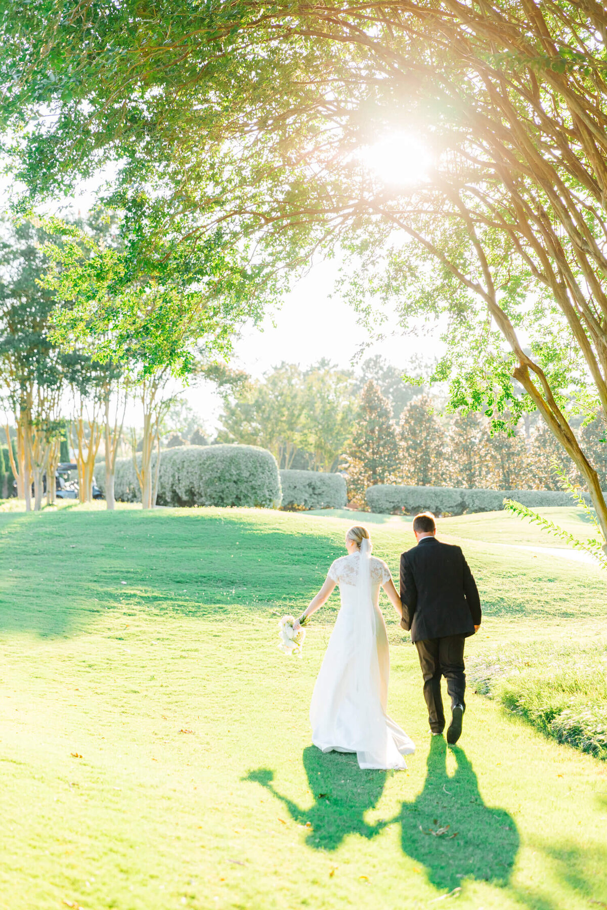 couple-walking-away-on-golf-course