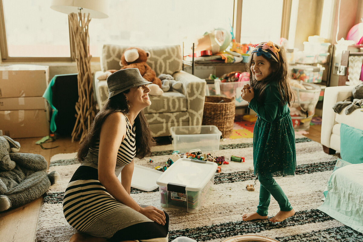 Bay Area mom and daughter play dress up during lifestyle in home photo session