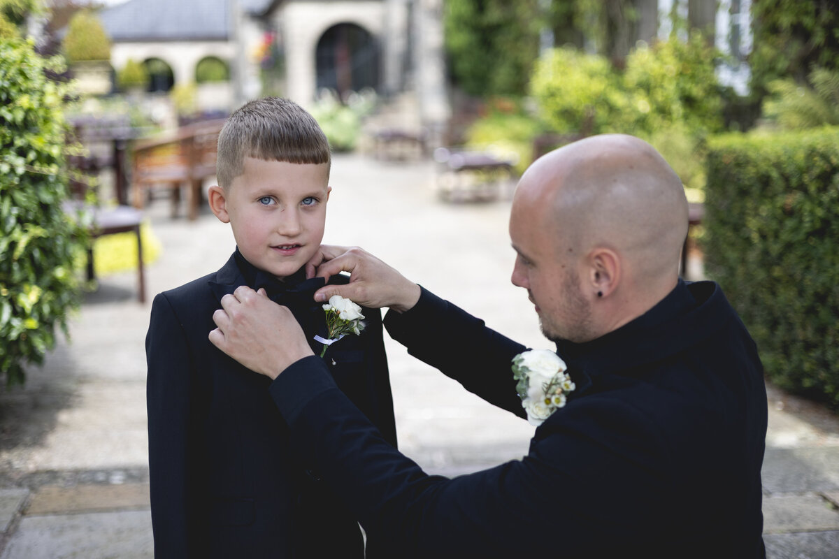 Matt sorting his sons bowtie