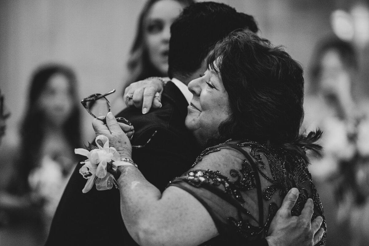 mother of groom embrace after wedding ceremony