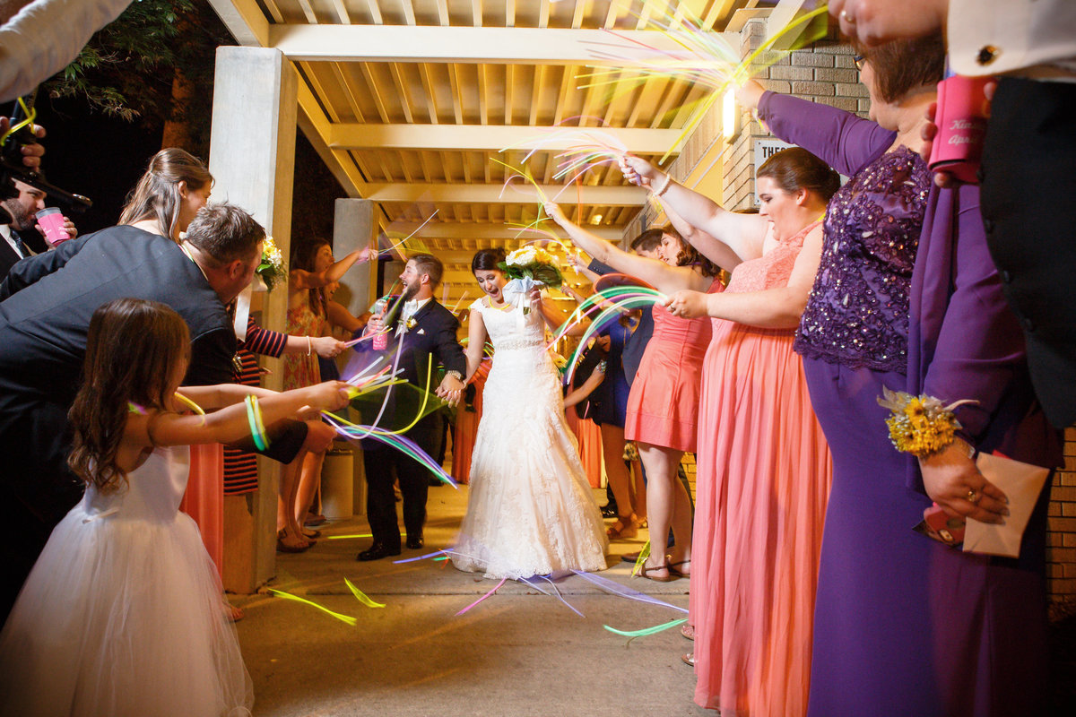 The couple used glow sticks for their exiting the wedding reception.