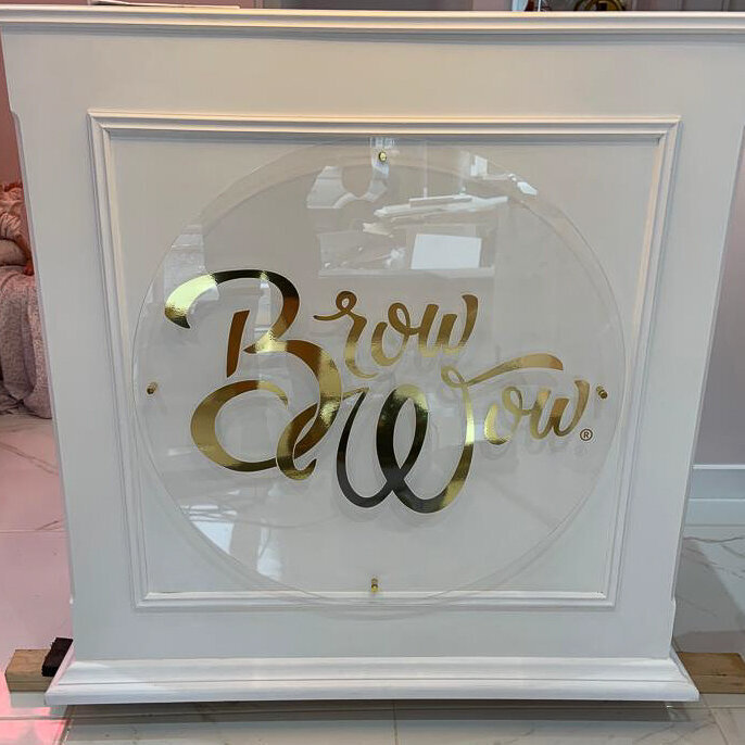 Acrylic circle with gold vinyl lettering