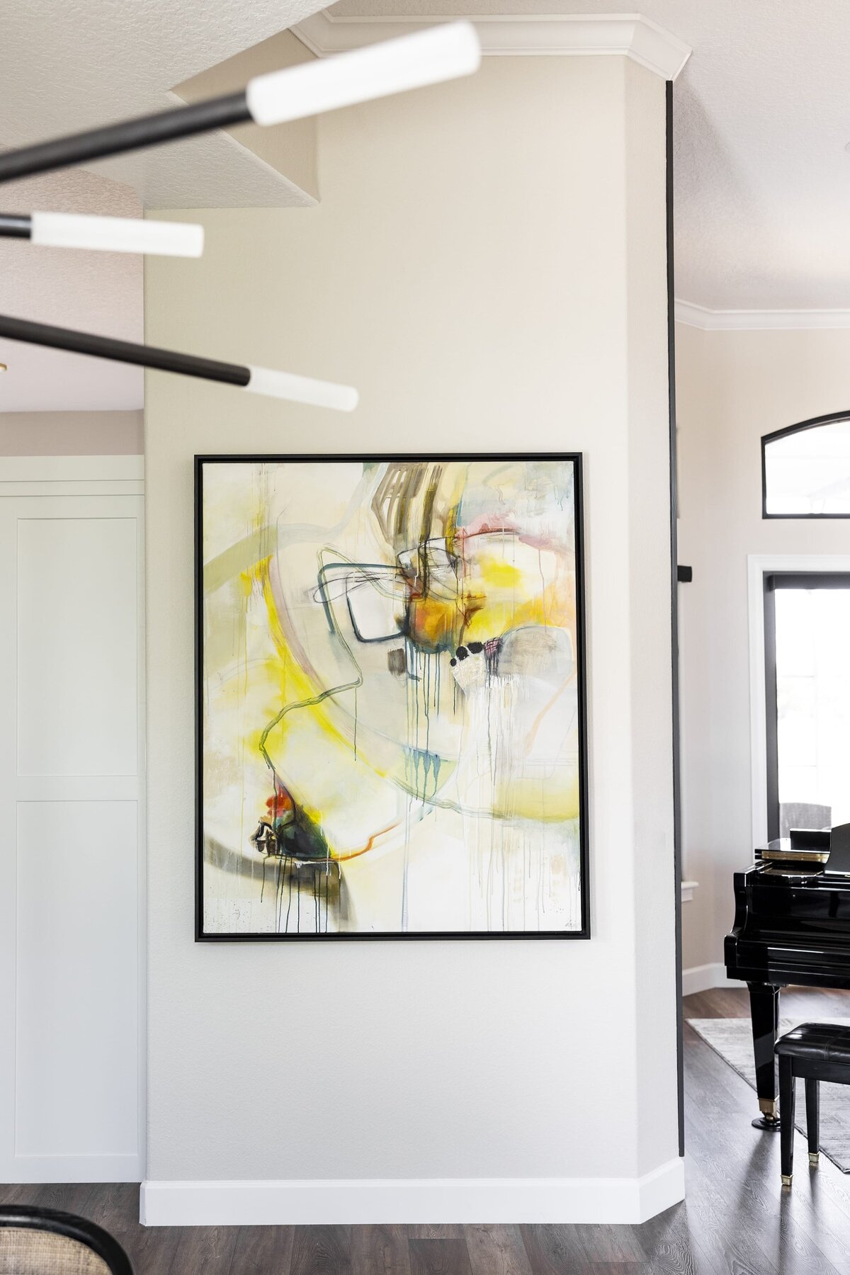 dewine design orlando interior designer windermere full home renovation black trimmed artpiece in entryway