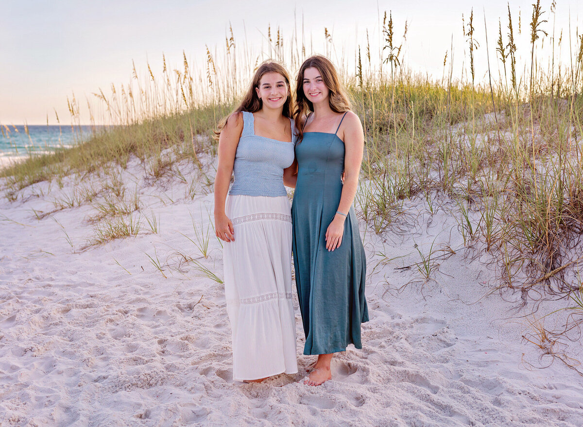 sisters-in-dresses-posing-for-pictures