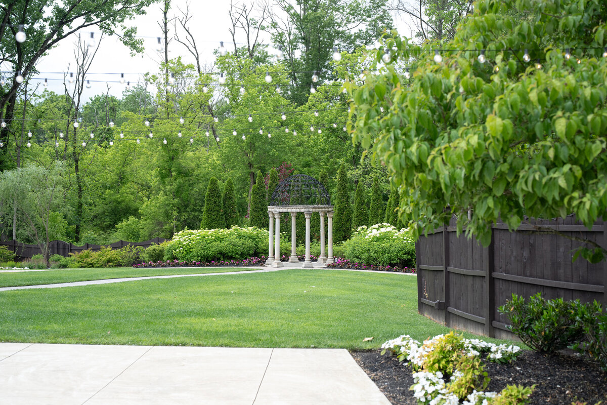 the garden ceremony and string lights patio at the hamilton manor nj