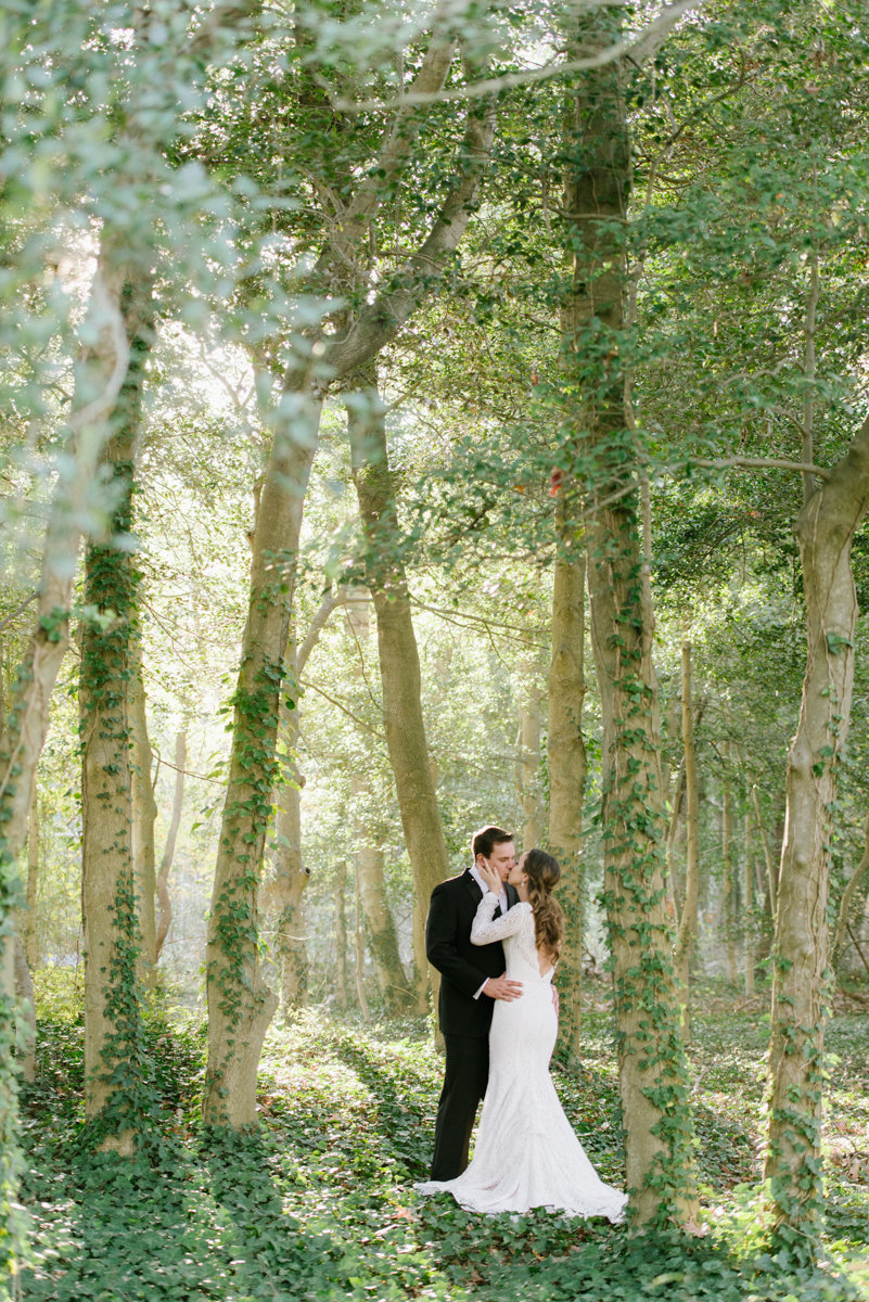 whimsical wedding trees woodland bohochic ivy forest kiss wedding photography