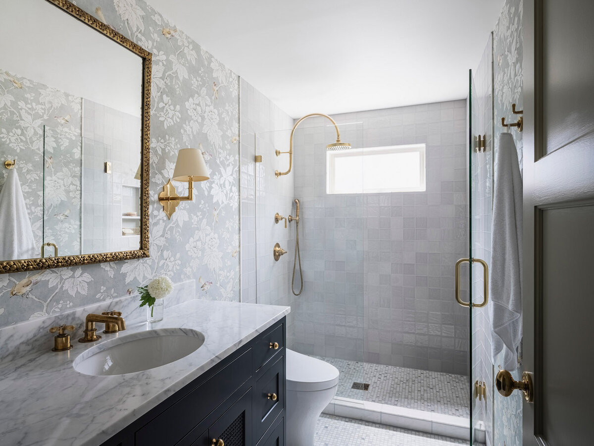 luxury-bathroom-design-gold-fixtures-floral-wallpaper-walk-in-shower