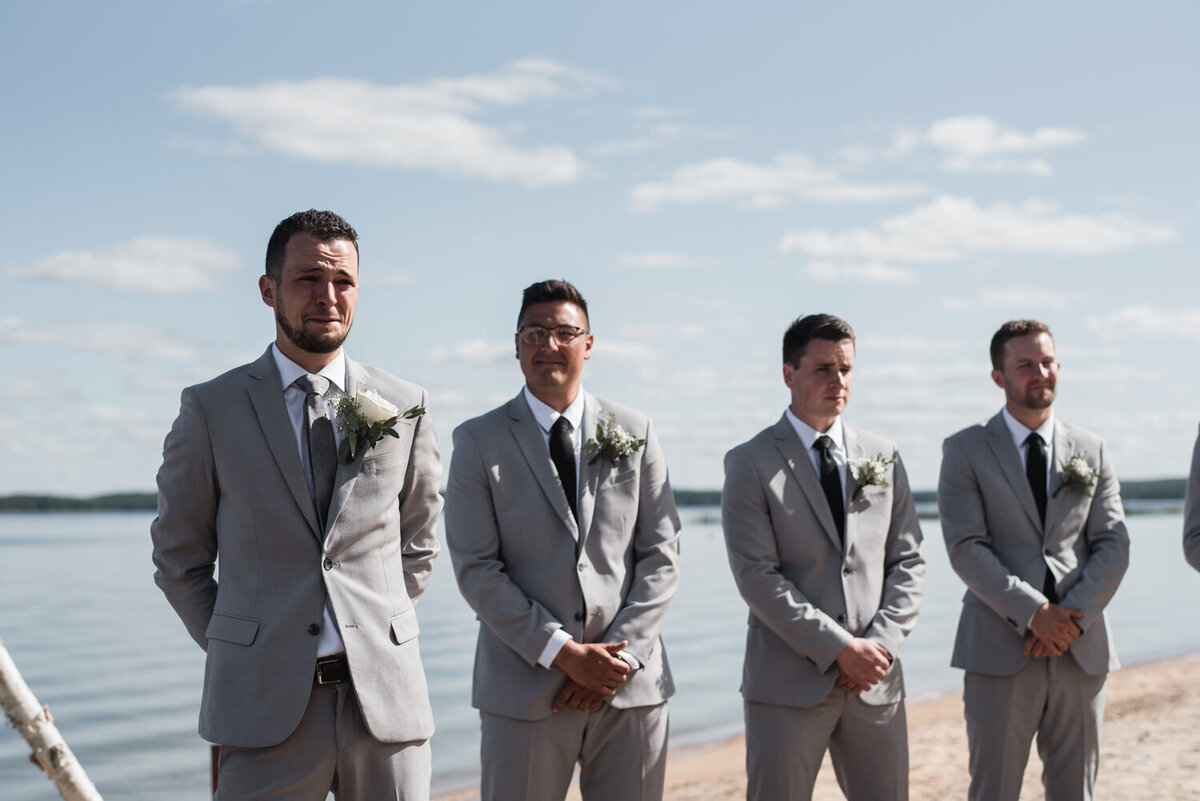 emotional-first-look-down-aisle-wedding-ceremony-lake-muskoka-ontario-photos
