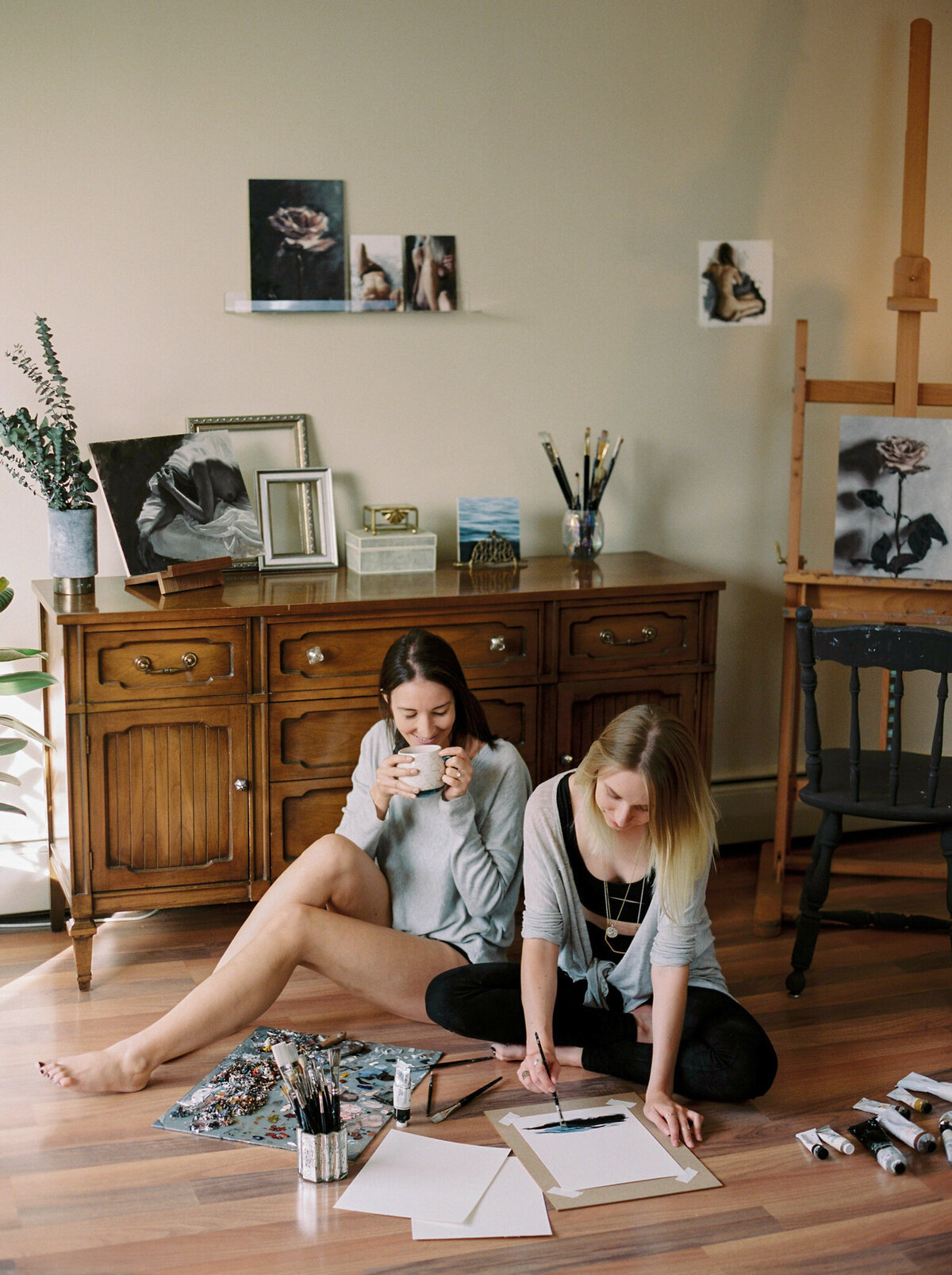 In-home engagement session, same sex couple sits on floor in living room together, captured by Justine Milton Photography, fine art  wedding photographer & videographer in Calgary Alberta. Featured on the Bronte Bride Vendor Guide.