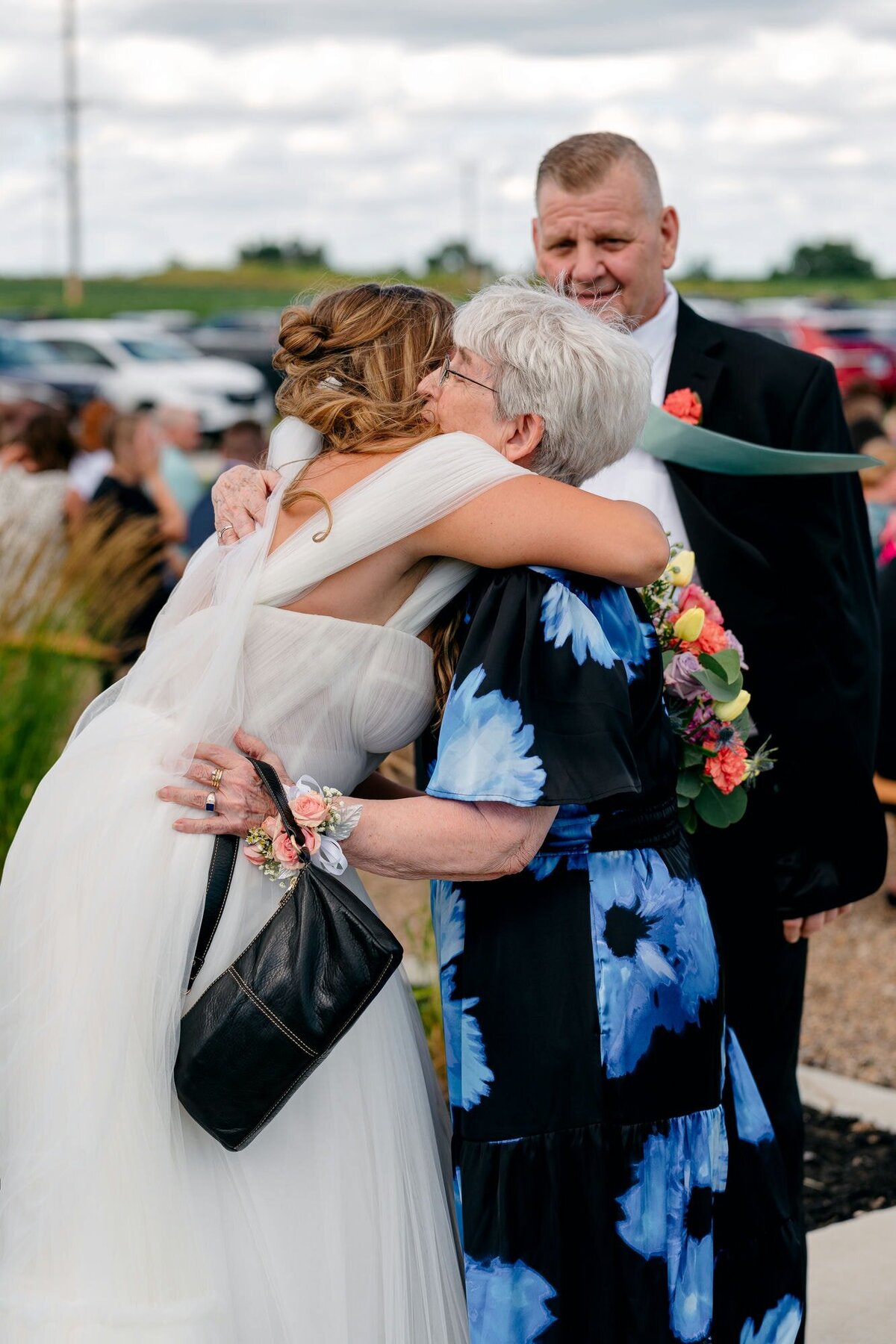 bride-hugging-her-guest