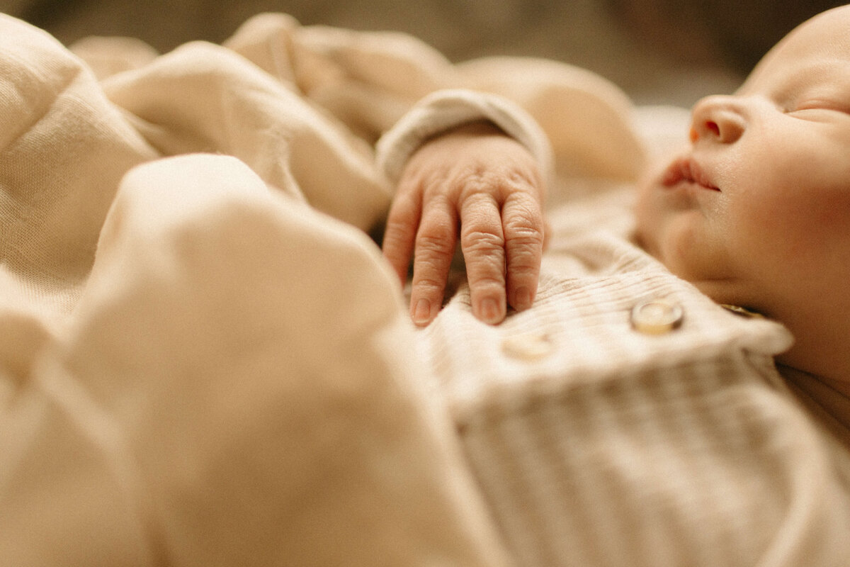 Parents looking at newborn in hospital bassinet during Nashville Fresh 48.