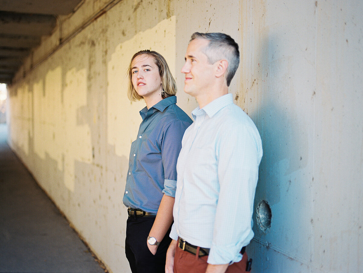 dad and son stand in a tunnel in longmont, colorado