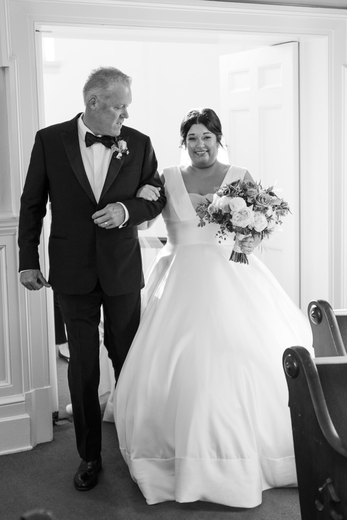bride walking down the aisle with dad