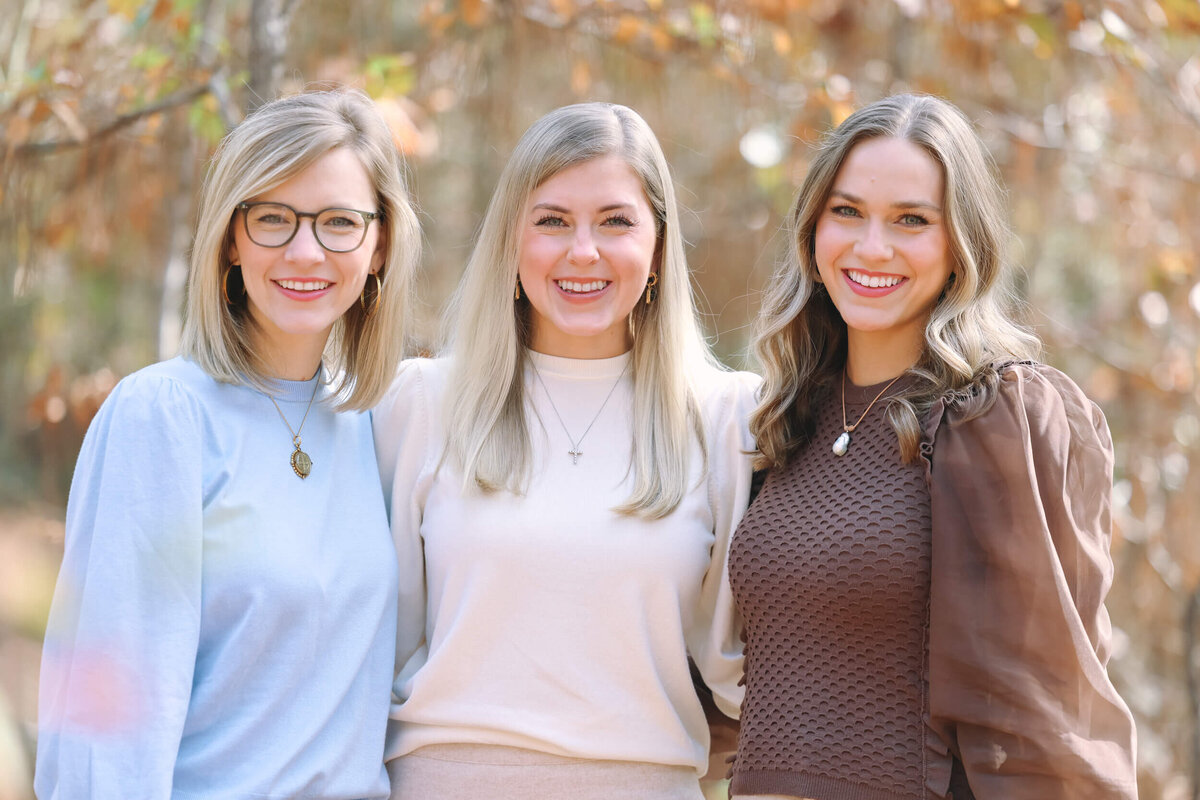 adult-sisters-smiling-at-camera