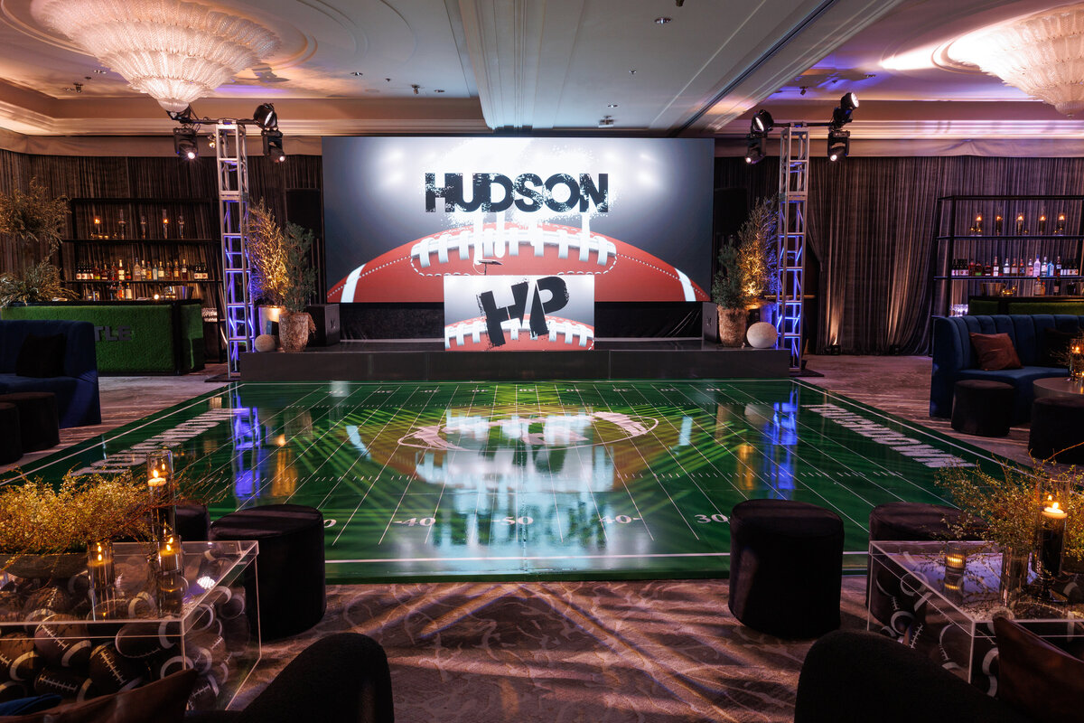 A ballroom with a football themed dance floor