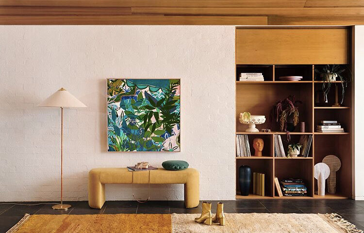 Mid-century style living room with vibrant green artwork, timber cabinetry and yellow bench styled by residential interior designer Melbourne.