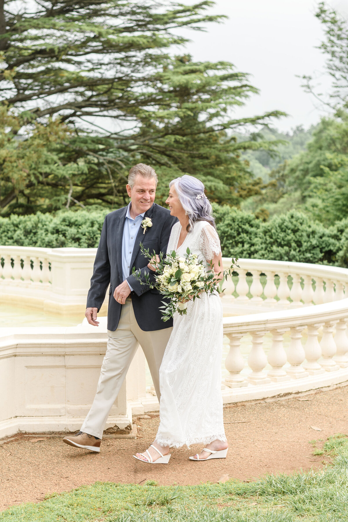 Husband & wife walking together at Maymont in Richmond