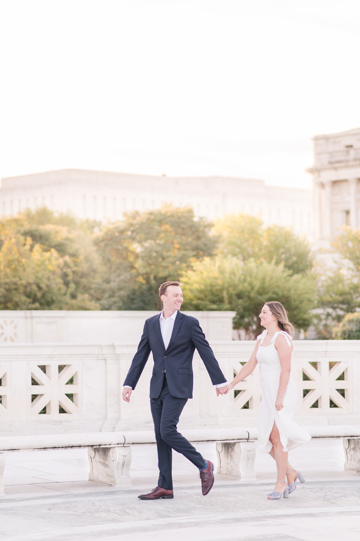 couple strolling at supreme court engagement