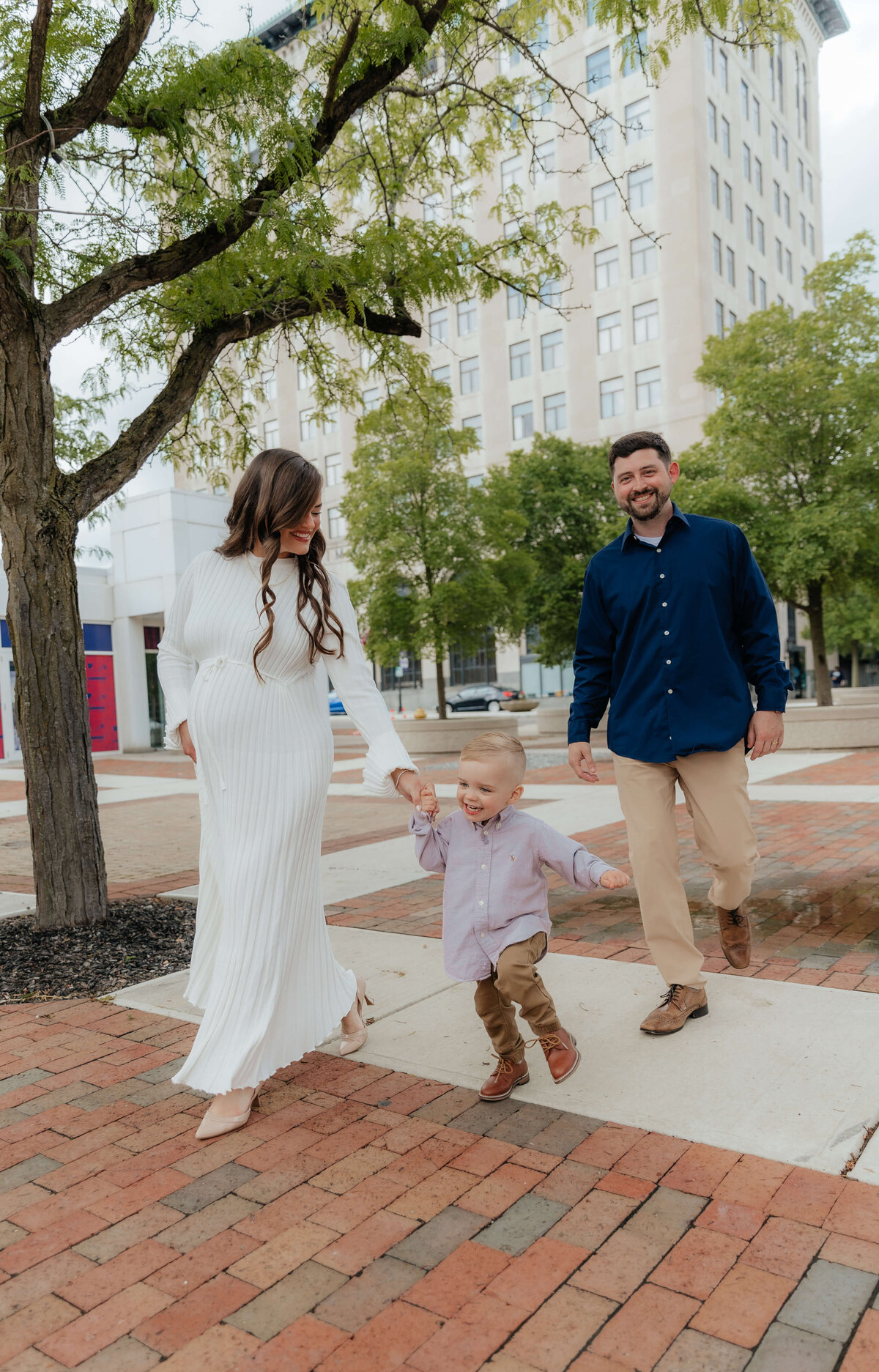 Columbus Ohio lifestyle family session with toddler and expecting parents, candid maternity photos full of laughter and love