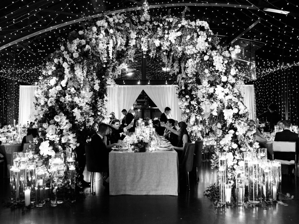 A Timeless Wedding Reception Under a Canopy of Flowers and Lights