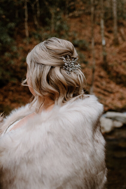 Bridal updo hairstyle for fall wedding.