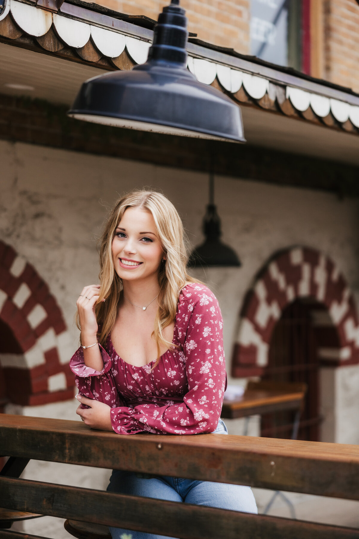 pretty blonde senior poses in San Marcos