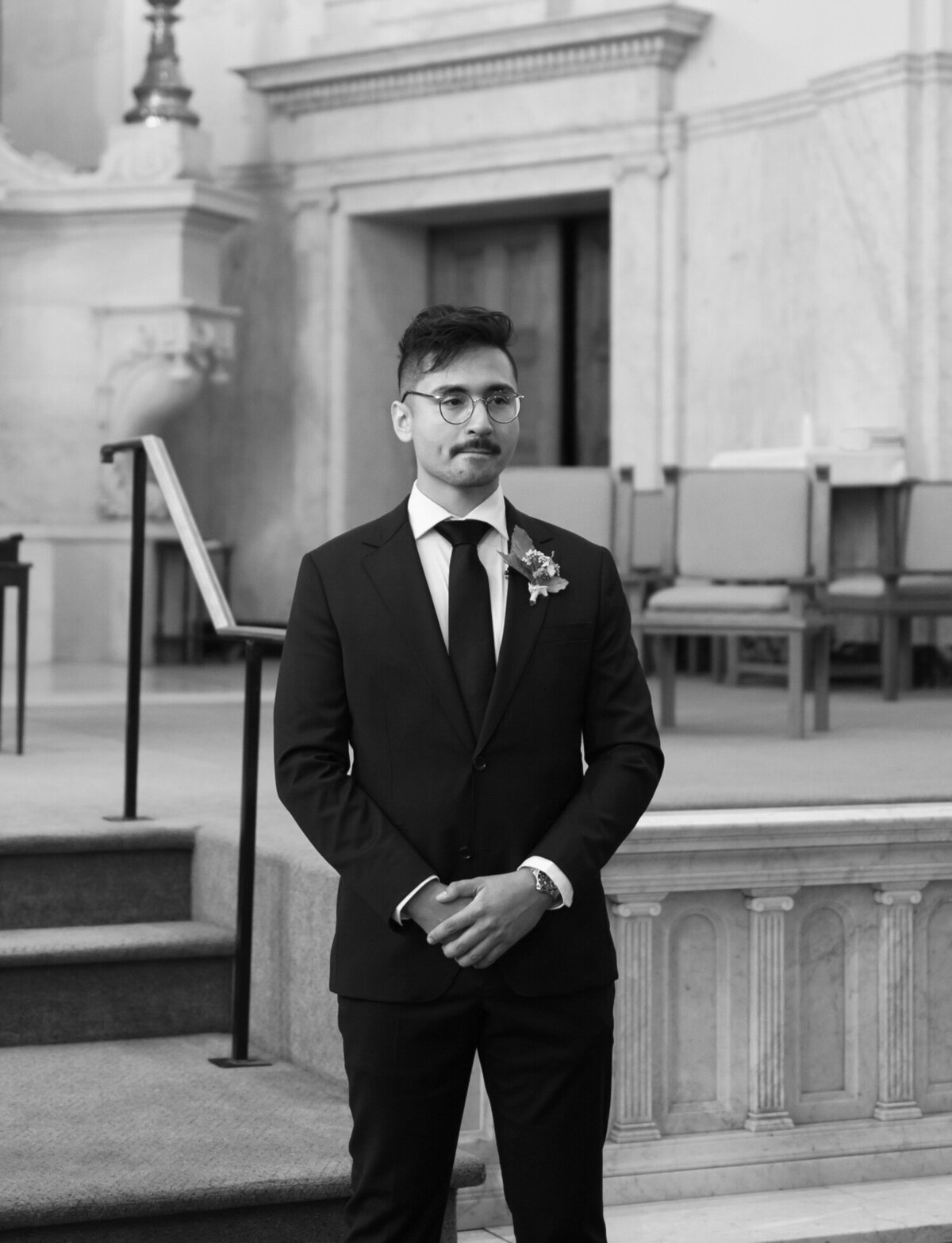 an emotional groom sees his bride for the first time at St. Peter and Paul church in Detroit