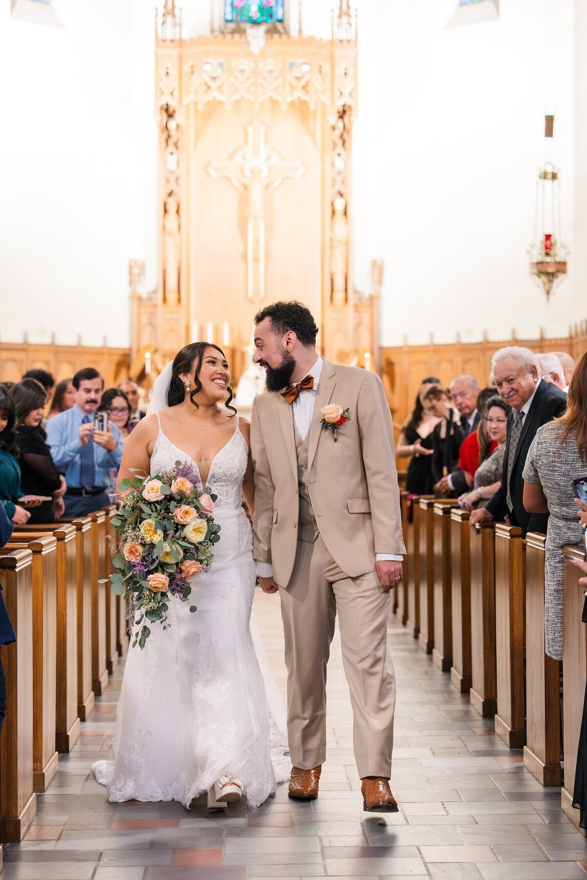 Bride and groom walking up aisle after ceremony