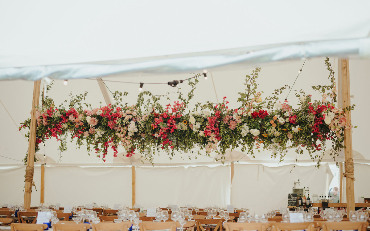 Flower cloud in traditional canvas marquee