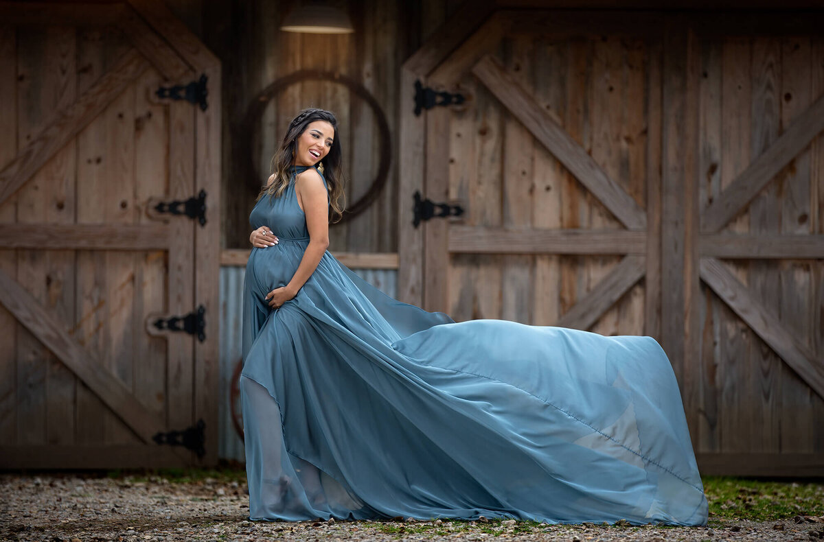 Blue dress flying on a Houston Maternity Photography Session by Danielle Dott