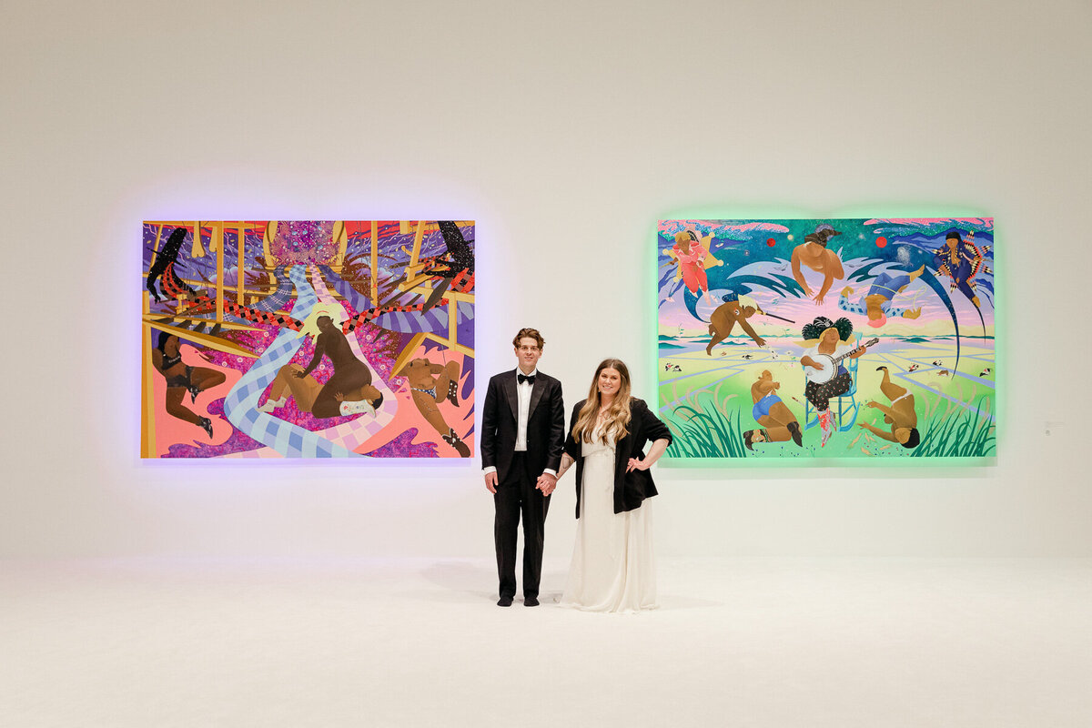 A couple posed for a portrait in an art museum