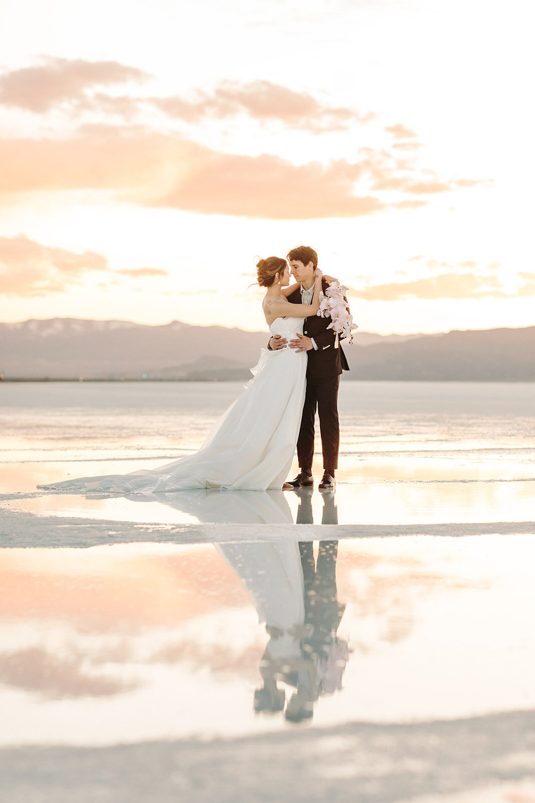 Utah Wedding Photography capturing groom holding bride during Spring wedding
