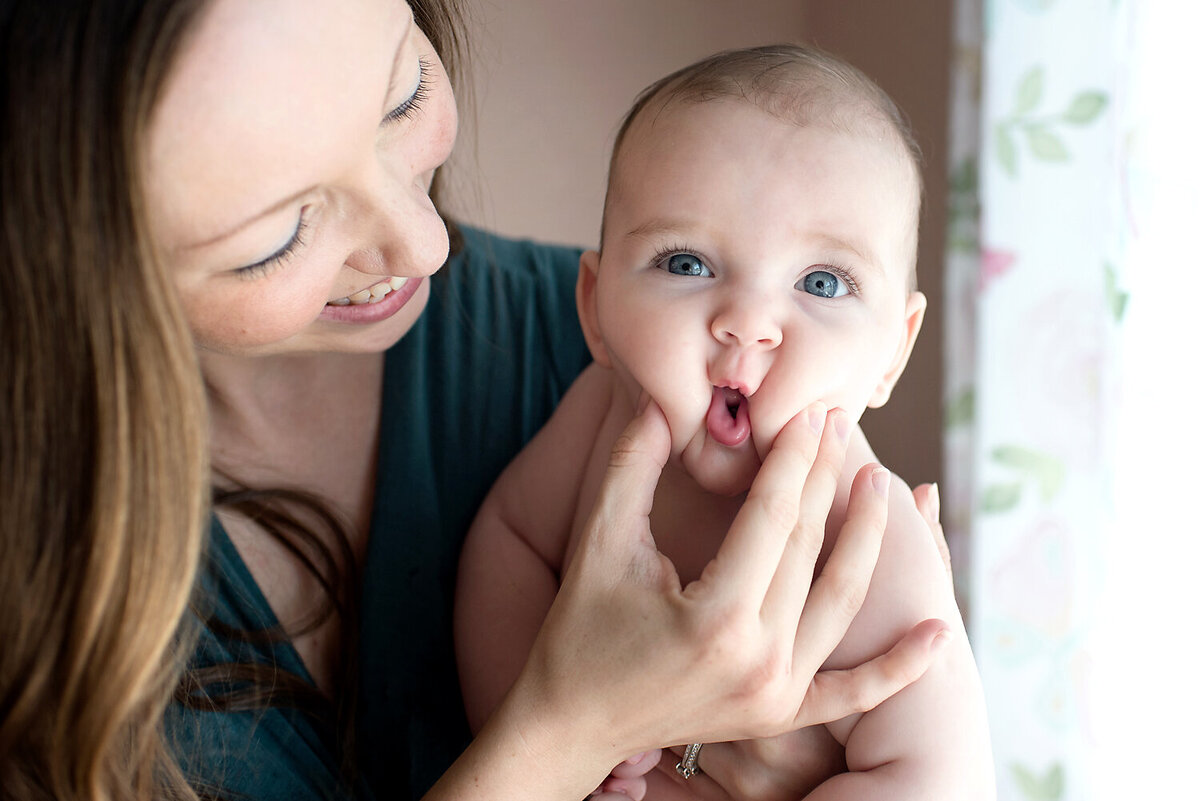 Newborn baby girl with great cheeks.