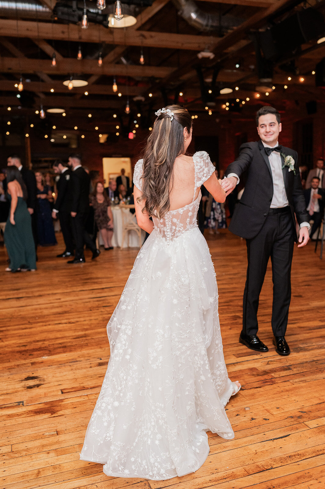 bride and groom dance to their wedding song