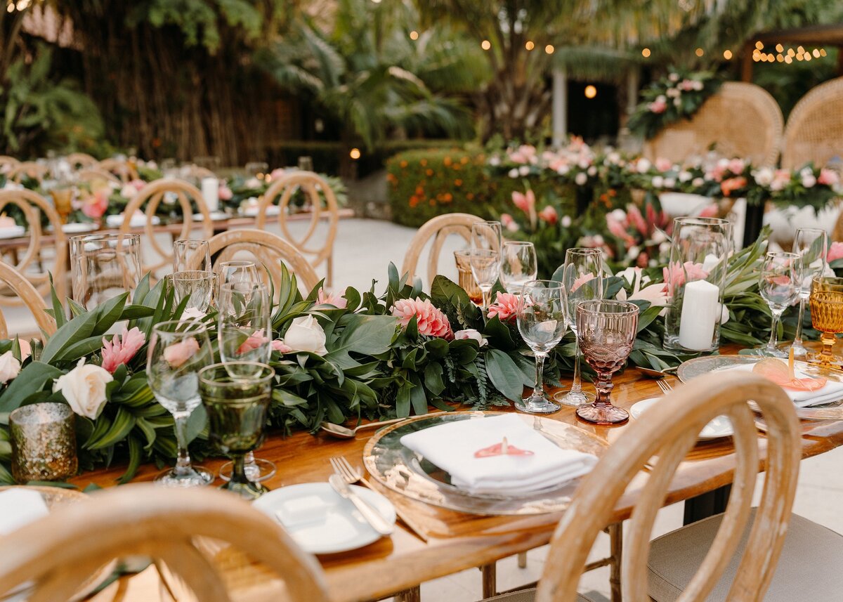 Reception table decorated with flowers and tableware