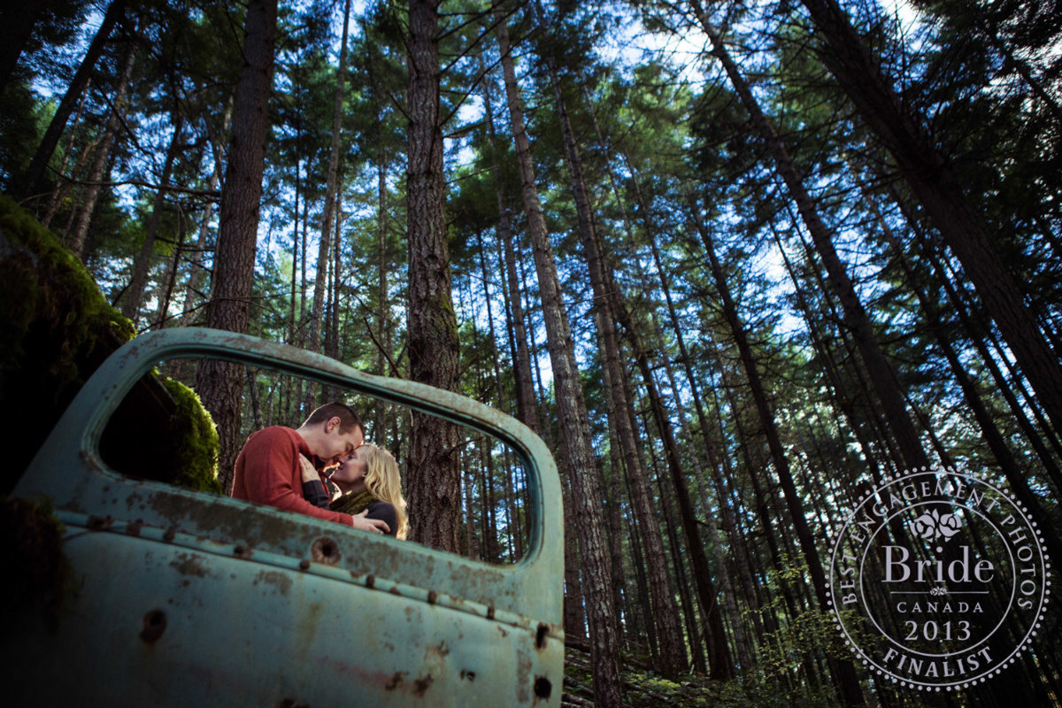 Old car, old forest and newly engaged couple