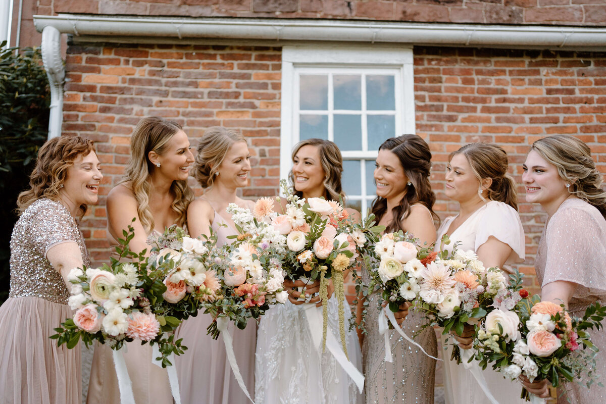bride with bridesmaids at fall wedding in Lancaster, PA