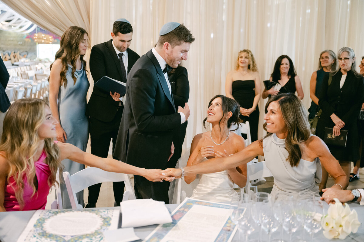 A bride gazes at her groom during their bedecken at Evergreen Brick Works planned by Melissa Baum