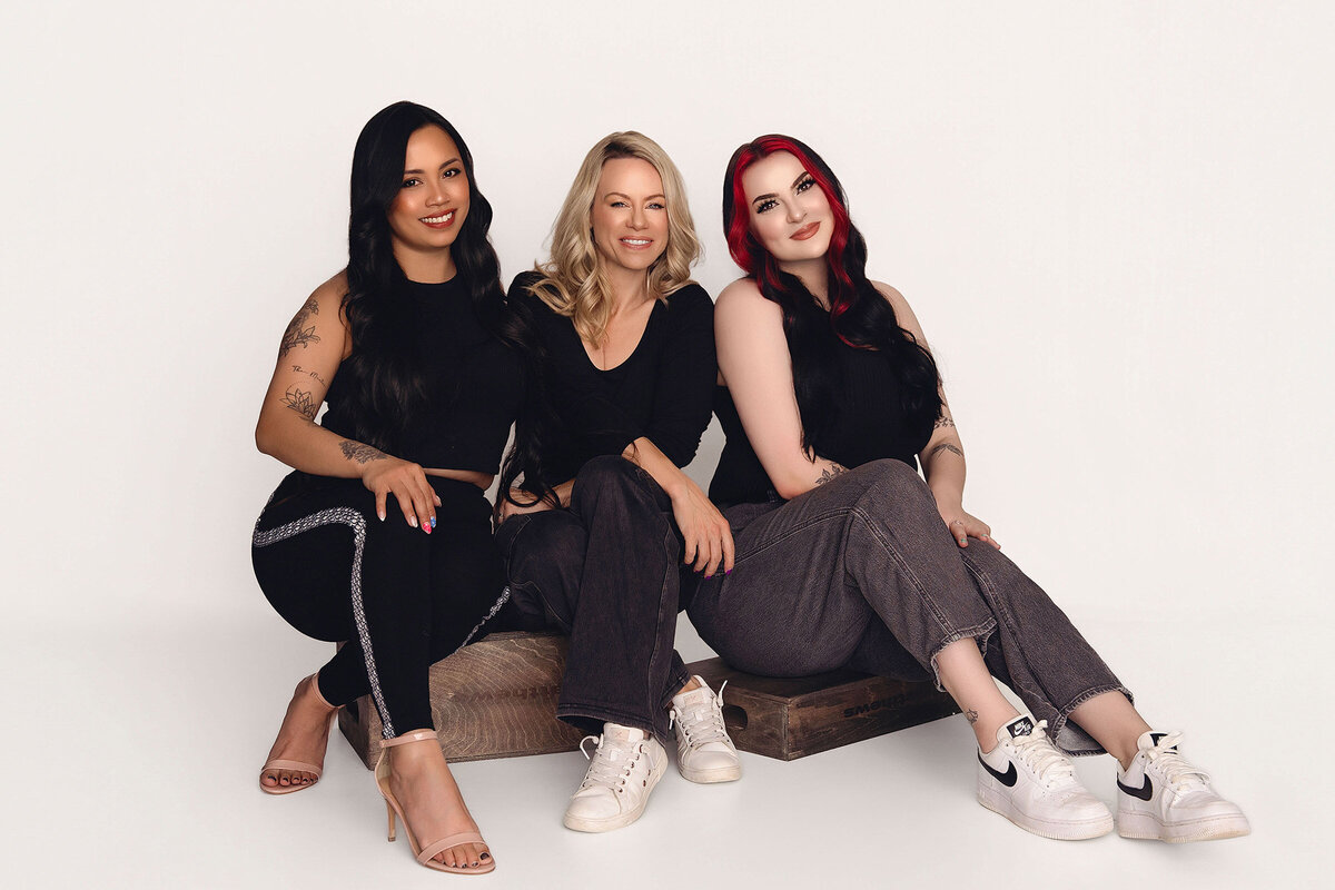 Three Vancouver Photographers pose on boxes for a photoshoot