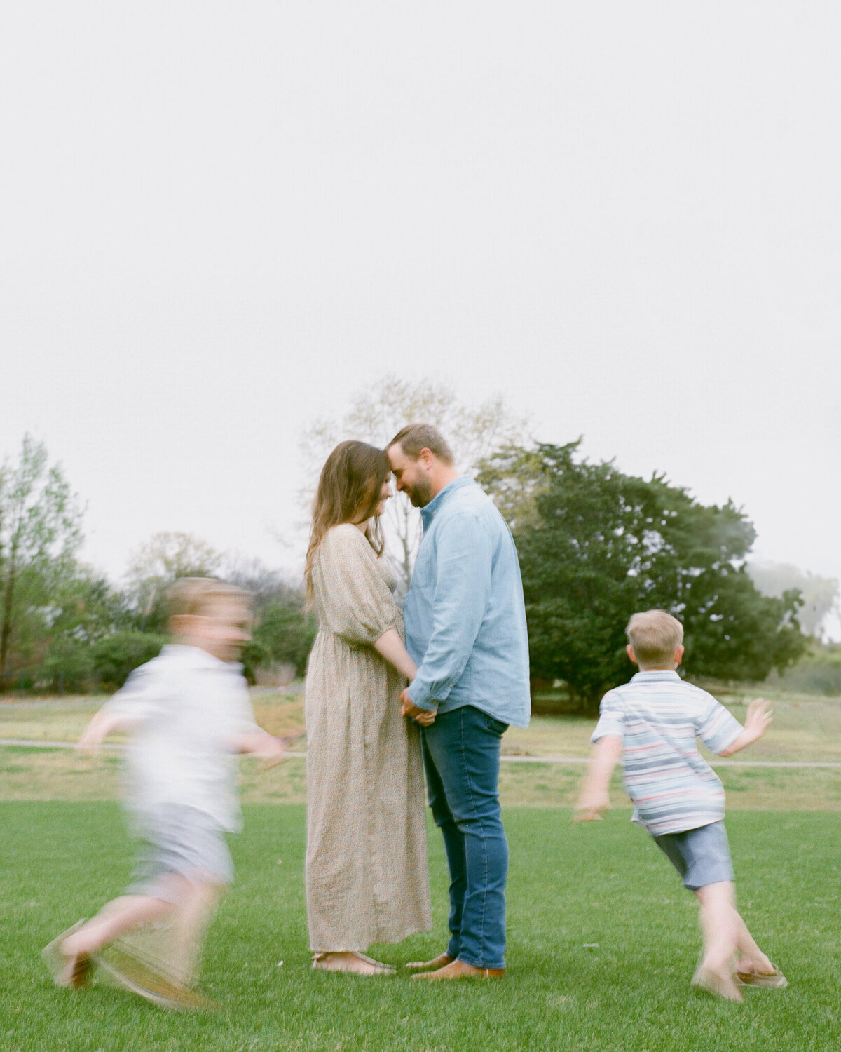 couple and children at family session at huntsville botanical garden by fauna & film, huntsville photographers