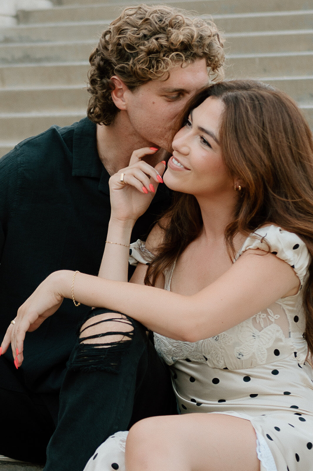 couple sitting on stairs during couples session