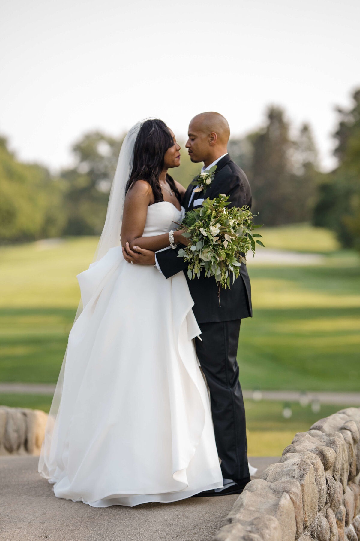 black couple with bridal bouquet